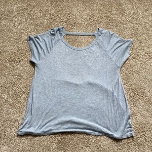 Blue tee shirt with open back.
